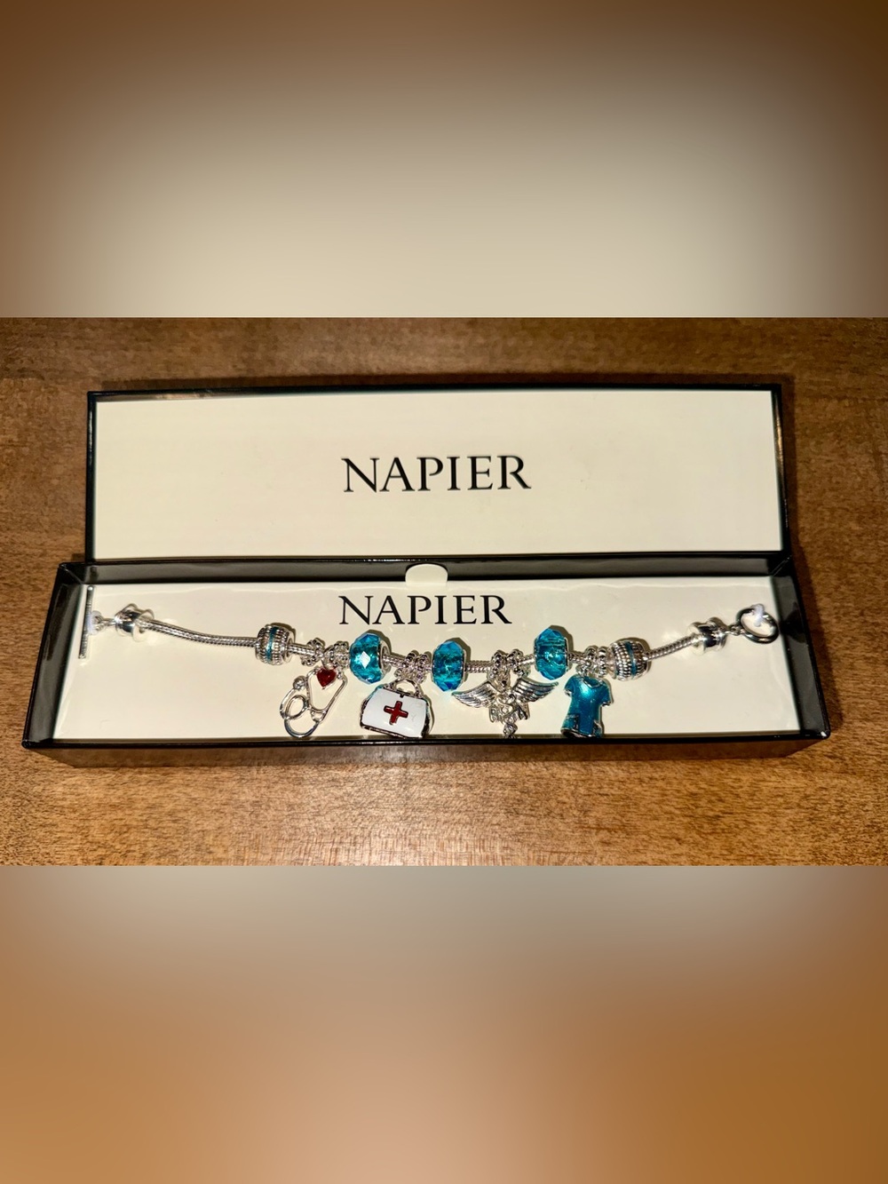 Napier Silver-Tone Blue Crystal Nurse Charm Bracelet